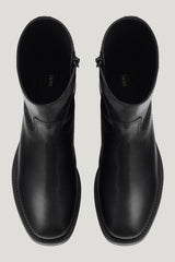 Daryl Ankle Boot in Black Leather — model side