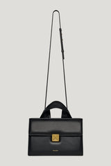 The SANDI Lock - Top handle bag — model side