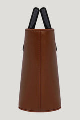 Baby Riviera In Caramel Leather — model side