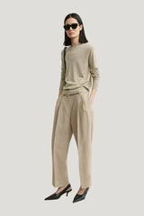 Double-pleat cropped linen trousers — model front