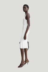 Fluted hem dress optic — model side