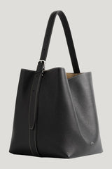 Medium belted grained-leather tote — model front