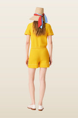 Knit playsuit with polo collar — model back