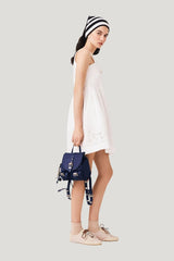 Short dress with lace trim — model side